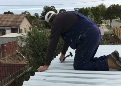 Flat Colorbond Roof with man