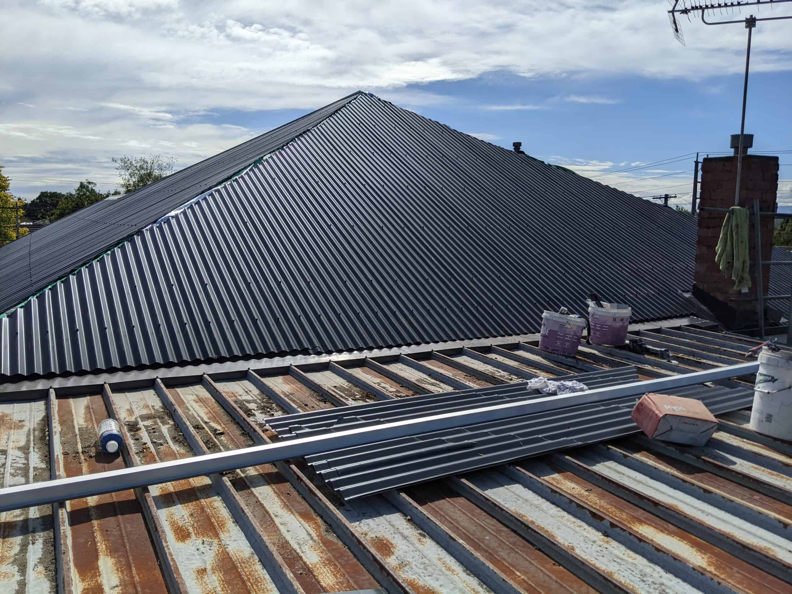 roofing services Mordialloc, colorbond roofing being installed on old tin roof